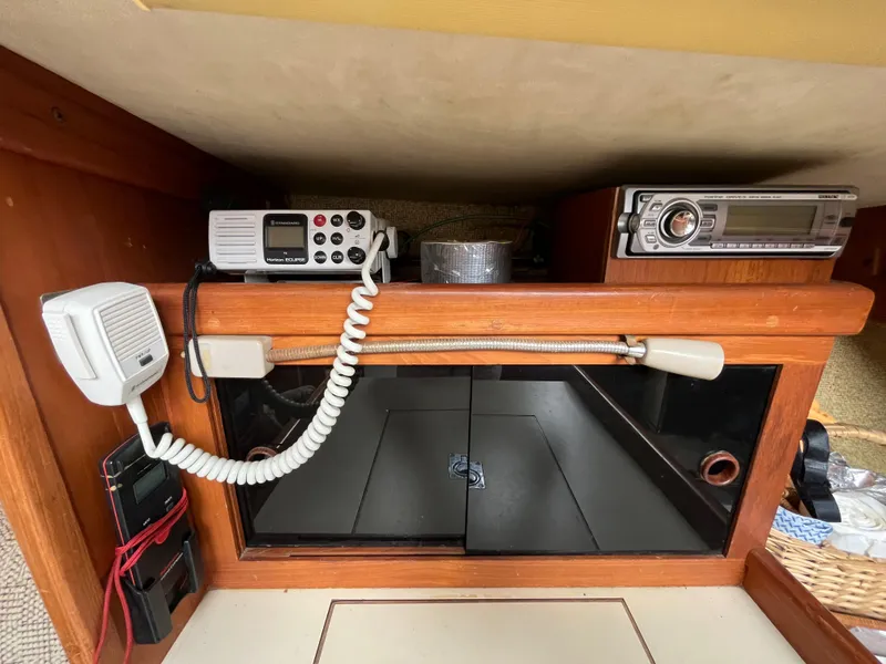Slide: The Image of Interior electronics of a 1979 Ranger Yachts 30, featuring communication and audio equipment. - 36