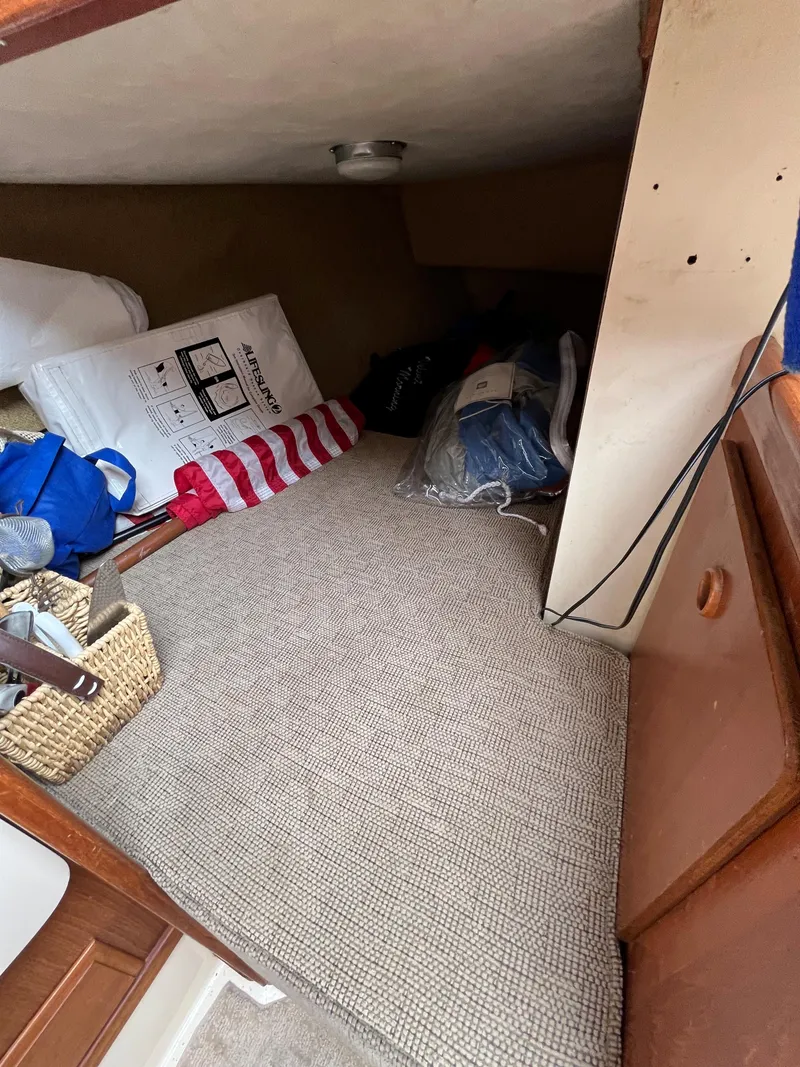 Slide: The Image of Interior cabin of 1979 Ranger Yachts 30 with storage and bedding. - 37