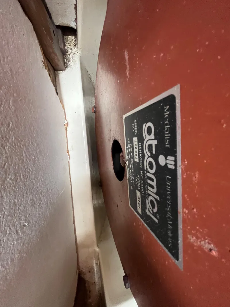 Slide: The Image of 1979 Ranger Yachts 30 engine compartment with Atomic 4 engine label. - 40