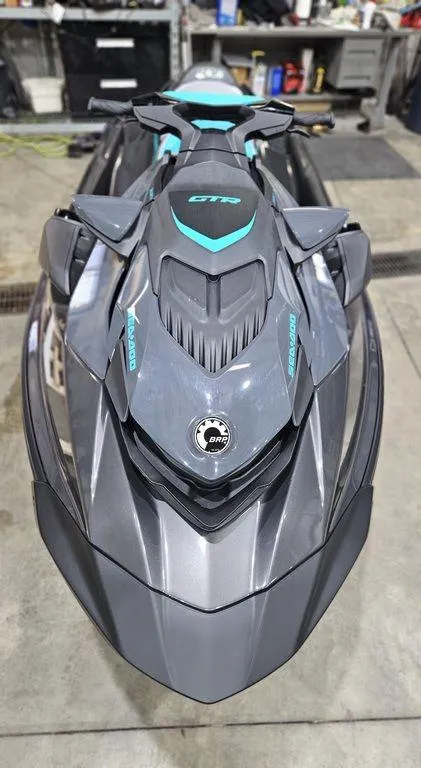 Slide: The Image of 2024 Sea-Doo GTR™ 230 BRP Premium Audio, iBR jet ski in a garage. - 3