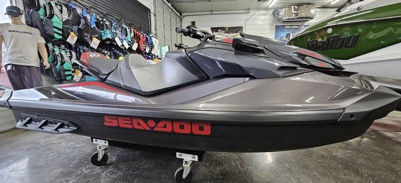 Slide: The Image of 2024 Sea-Doo GTR™-X 300 iBR jet ski in showroom. - 1