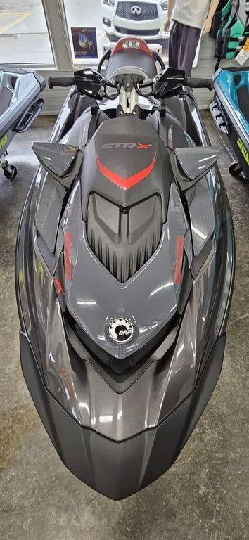 Slide: The Image of 2024 Sea-Doo GTR™-X 300 iBR jet ski in showroom. - 2