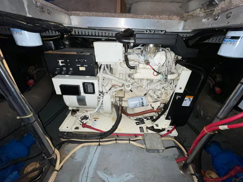 Slide: The Image of Engine compartment of a 1996 Carver 370 Aft Cabin boat, showcasing mechanical components. - 1
