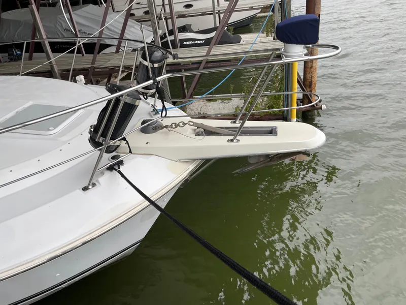 Slide: The Image of 1996 Carver 370 Aft Cabin boat docked, showing bow and anchor details. - 14