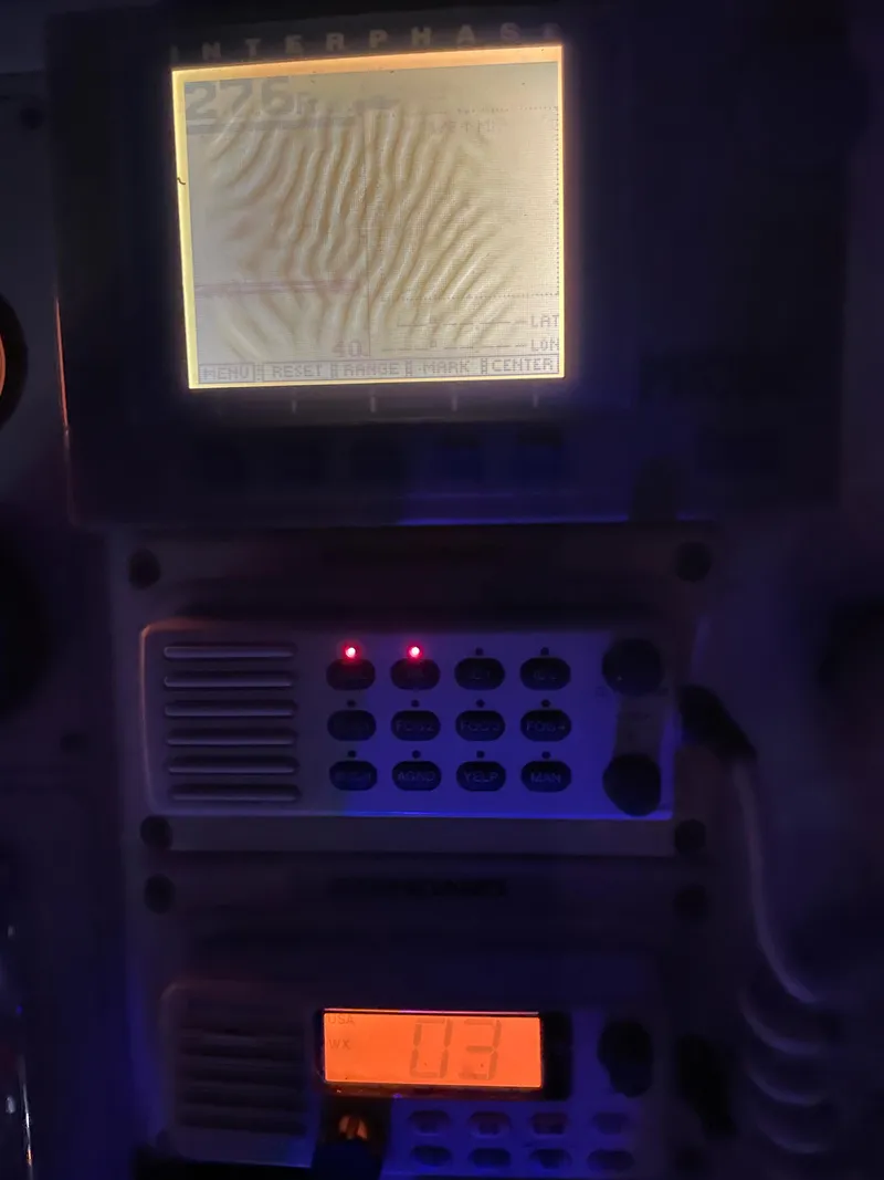 Slide: The Image of 1996 Carver 370 Aft Cabin boat navigation equipment with illuminated screens. - 20