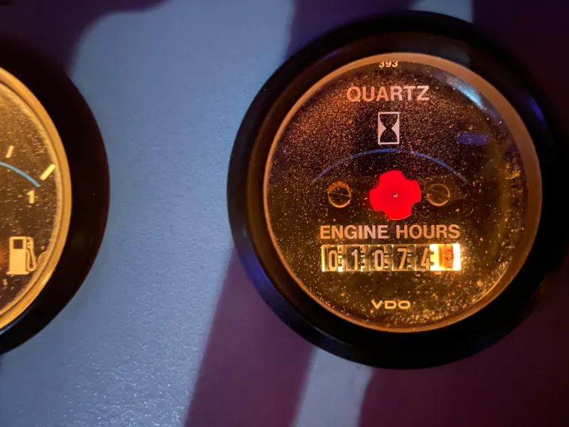 Slide: The Image of Close-up of 1996 Carver 370 Aft Cabin engine hour meter displaying 1107.4 hours. - 23