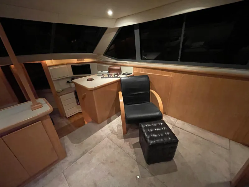 Slide: The Image of Interior of 1996 Carver 370 Aft Cabin with modern seating and navigation area. - 30