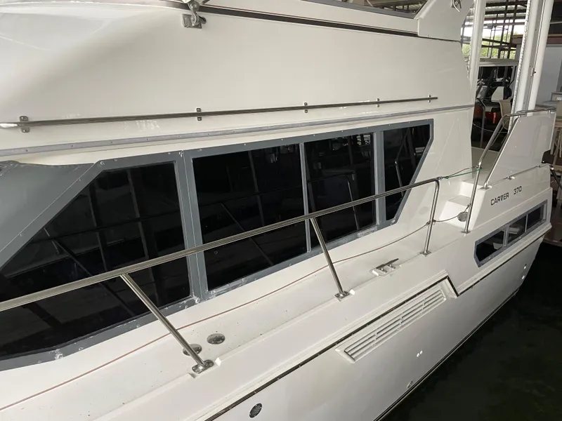 Slide: The Image of 1996 Carver 370 Aft Cabin yacht, side view in marina. - 8