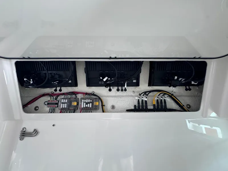 Slide: The Image of 2024 Everglades 395 CC boat electrical panel with wiring and components. - 21