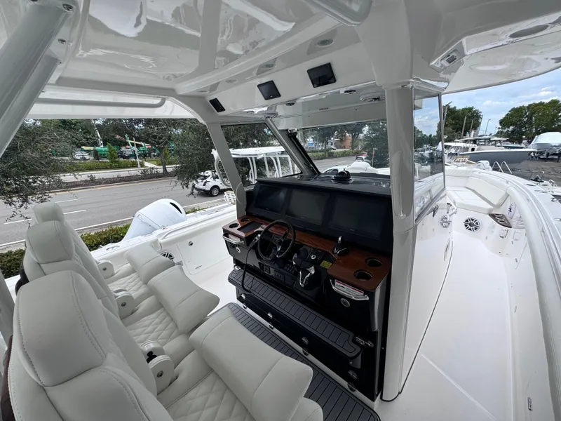 Slide: The Image of 2024 Everglades 395 CC boat interior with modern helm and seating. - 41