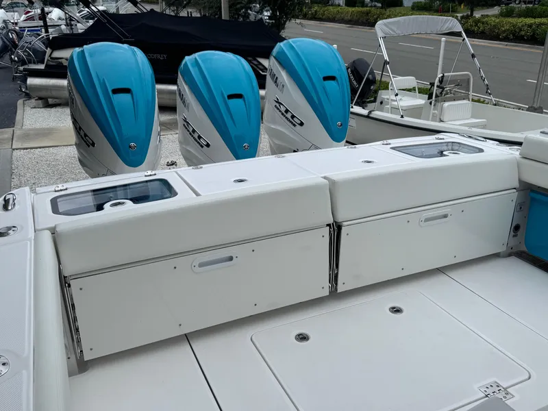 Slide: The Image of 2024 Everglades 395 CC boat with triple blue outboard engines. - 48