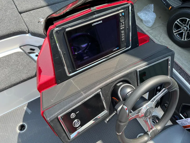 Slide: The Image of 2024 Ranger Z520R boat dashboard with Lowrance electronics and steering wheel. - 10