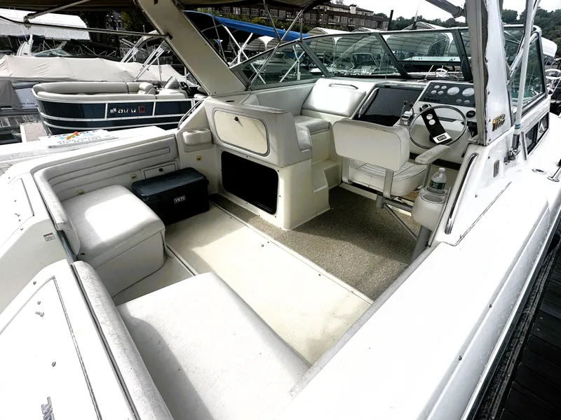 Slide: The Image of 1989 Tiara Yachts 310 SC boat interior with seating and helm station. - 4