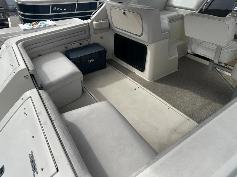 Slide: The Image of 1989 Tiara Yachts 310 SC interior with seating and storage compartments. - 5