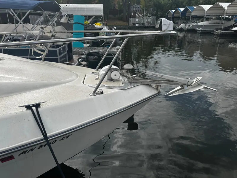 Slide: The Image of 1989 Tiara Yachts 310 SC docked at a marina. - 7