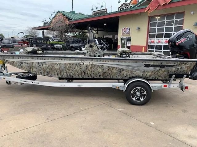 Slide: The Image of 2024 Ranger RB190 boat on trailer outside dealership. - 1