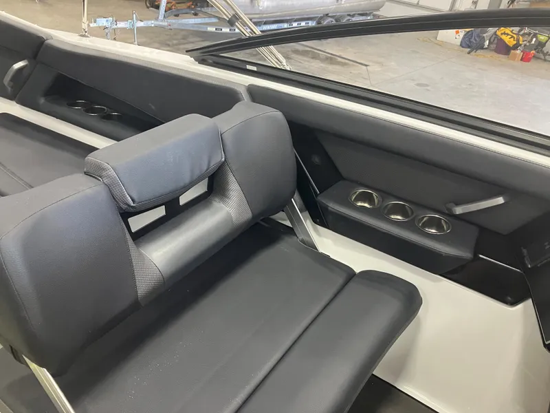 Slide: The Image of 2024 Scarab 285 boat interior with black leather seating and modern design. - 20