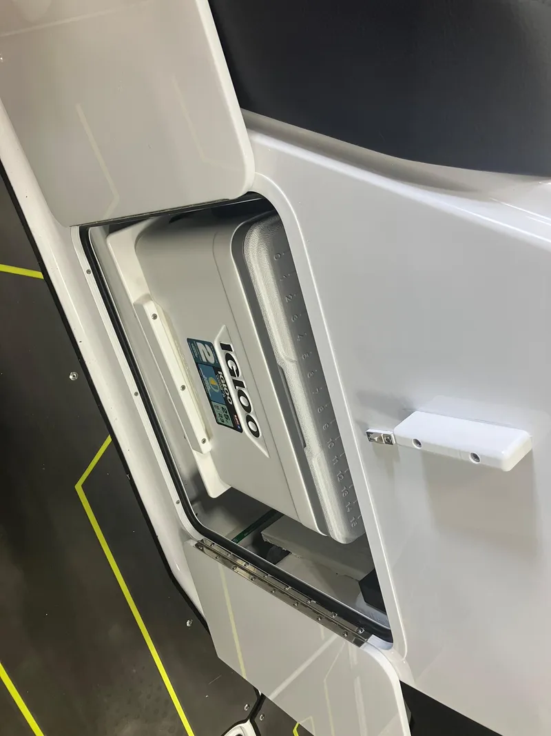 Slide: The Image of 2024 Scarab 285 boat storage compartment with integrated cooler. - 21