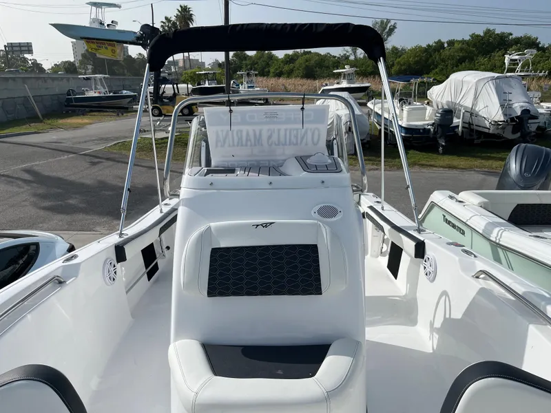 Slide: The Image of 2024 Tidewater 198 CC center console boat with seating and canopy. - 7