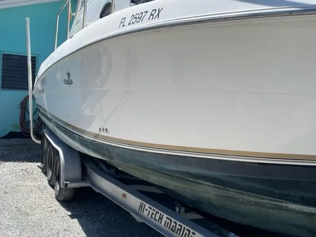 Slide: The Image of 2003 Wellcraft 270 Coastal O/B boat on a trailer, side view. - 3