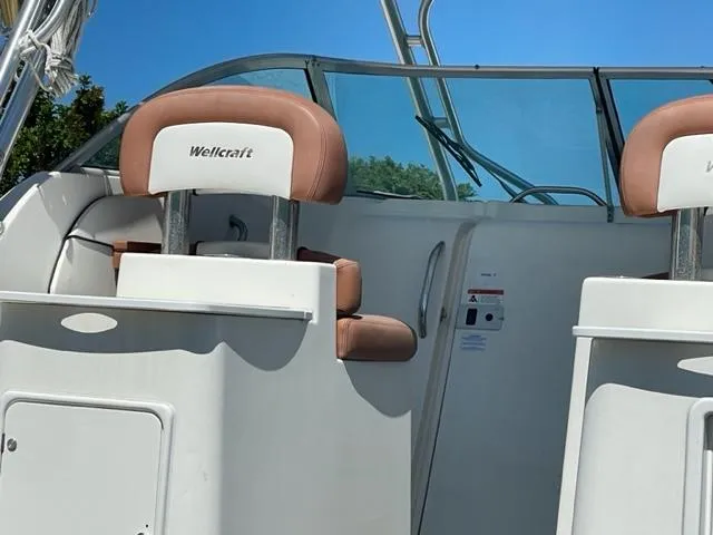 Slide: The Image of 2003 Wellcraft 270 Coastal O/B boat interior with tan seats and windshield. - 6