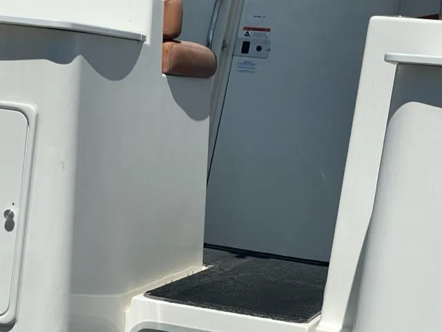 Slide: The Image of 2003 Wellcraft 270 Coastal O/B boat interior, showing steps and seating. - 7