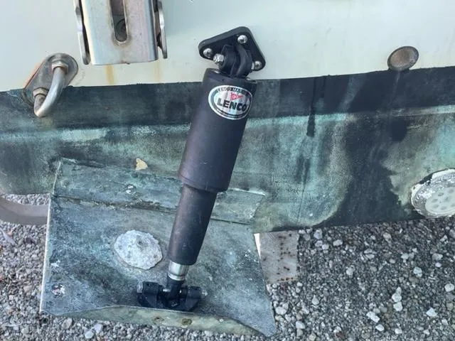 Slide: The Image of Close-up of a 2003 Wellcraft 270 Coastal O/B boat's Lenco trim tab actuator. - 9