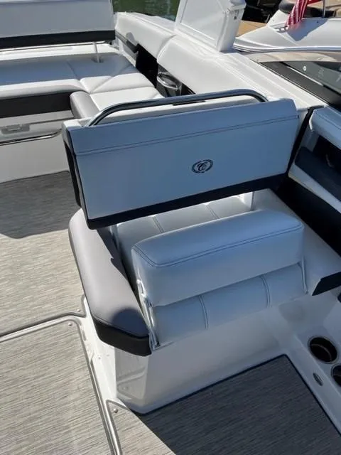 Slide: The Image of 2021 Cobalt R6 boat interior with white leather seating and modern design. - 10