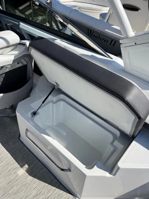 Slide: The Image of Open storage compartment on a 2021 Cobalt R6 boat. - 12