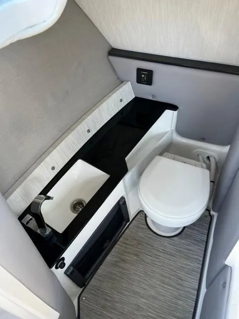 Slide: The Image of 2021 Cobalt R6 boat bathroom with sink and toilet - 2
