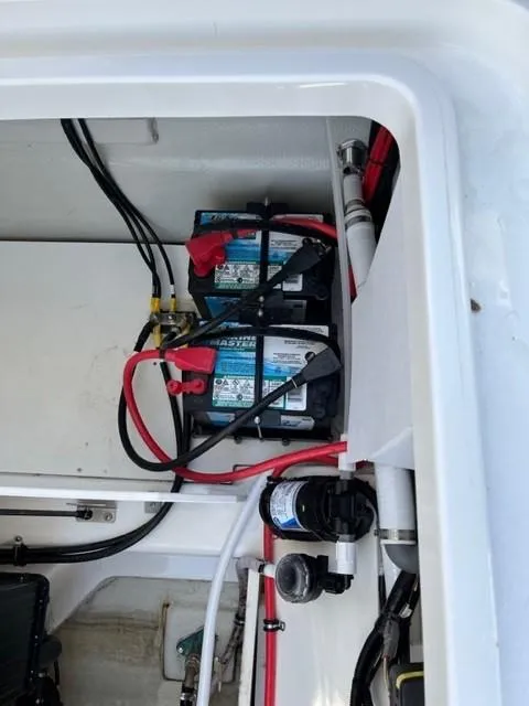 Slide: The Image of Battery compartment of a 2021 Cobalt R6 boat with wiring and components. - 4