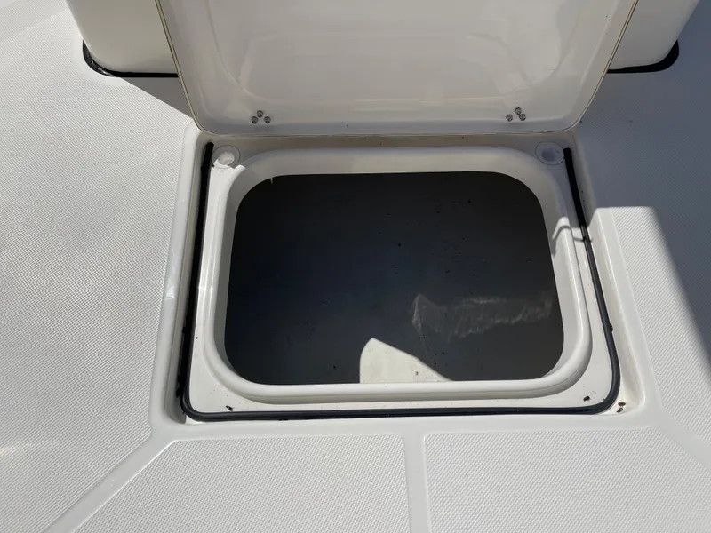 Slide: The Image of Open storage compartment on a 2024 Sea Born LX 26 boat. - 11