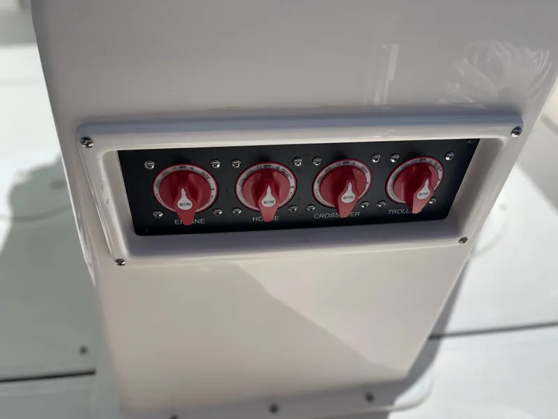 Slide: The Image of Control panel of 2024 Sea Born LX 26 boat with red switches. - 16