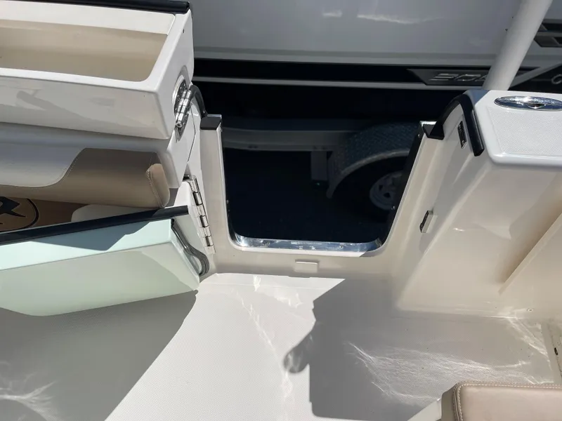 Slide: The Image of 2024 Sea Born LX 26 boat interior with open side door. - 17