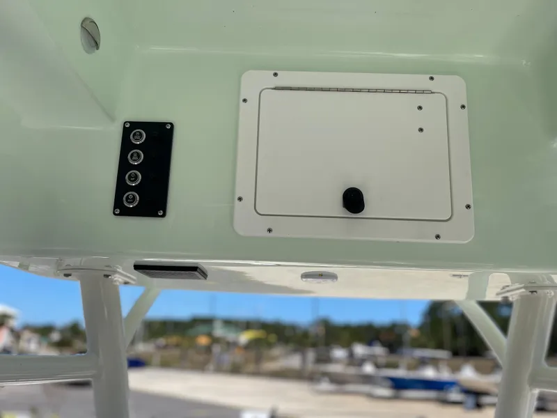 Slide: The Image of 2024 Sea Born LX 26 boat console with control panel and storage compartment. - 7