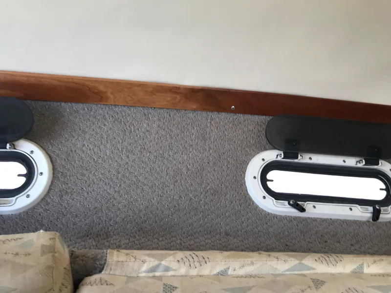 Slide: The Image of Interior cabin of 2002 Four Winns 245 Sundowner with porthole windows. - 19