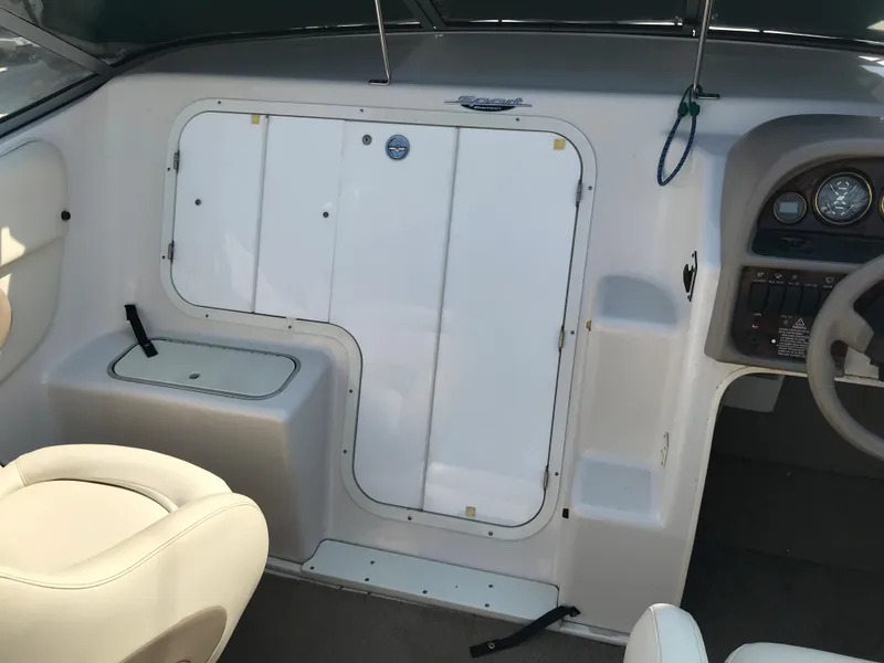 Slide: The Image of 2002 Four Winns 245 Sundowner boat interior with helm and seating. - 4