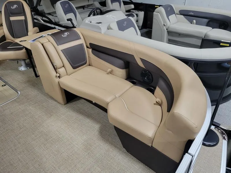 Slide: The Image of 2024 Barletta C22UC pontoon boat interior with beige seating and modern design. - 2