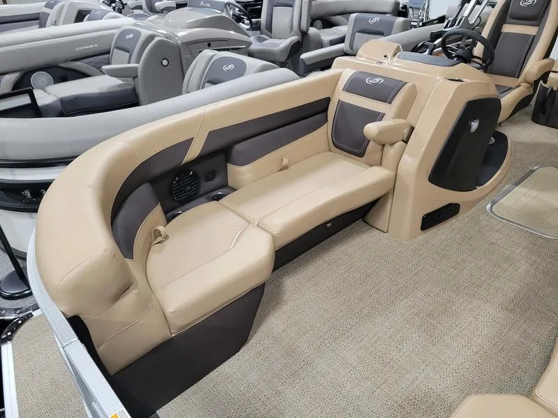 Slide: The Image of 2024 Barletta C22UC pontoon boat interior with beige seating and modern design. - 3