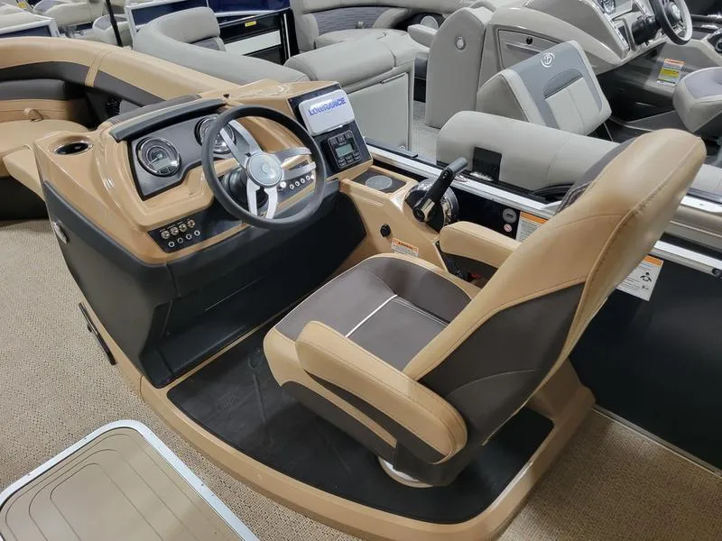 Slide: The Image of 2024 Barletta C22UC boat cockpit with modern controls and comfortable seating. - 4