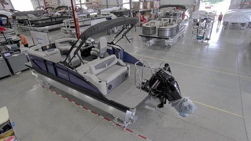 Slide: The Image of 2024 Barletta C20UC pontoon boat in a manufacturing facility. - 3