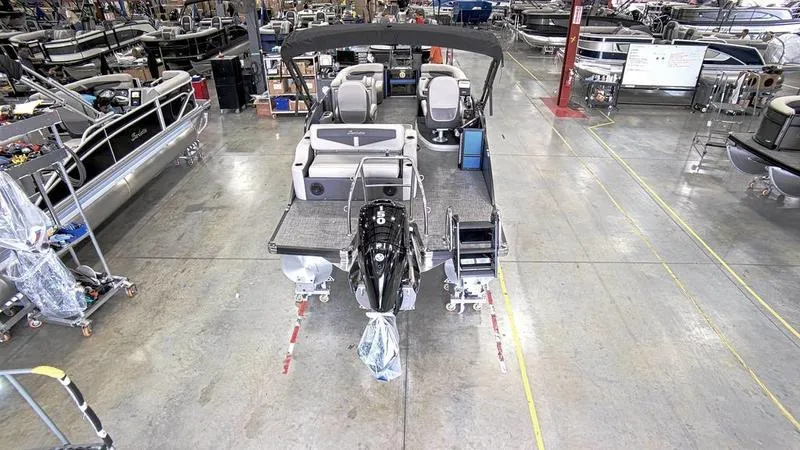 Slide: The Image of 2024 Barletta C20UC pontoon boat in a manufacturing facility. - 4
