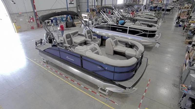 Slide: The Image of 2024 Barletta C20UC pontoon boat in a manufacturing facility. - 5
