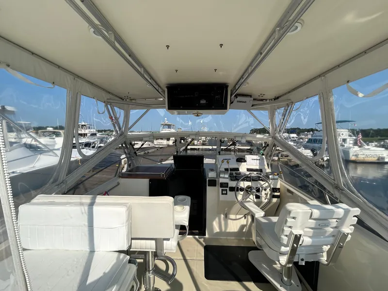 Slide: The Image of Interior view of 2003 Carolina Classic 28 boat with helm and seating. - 11