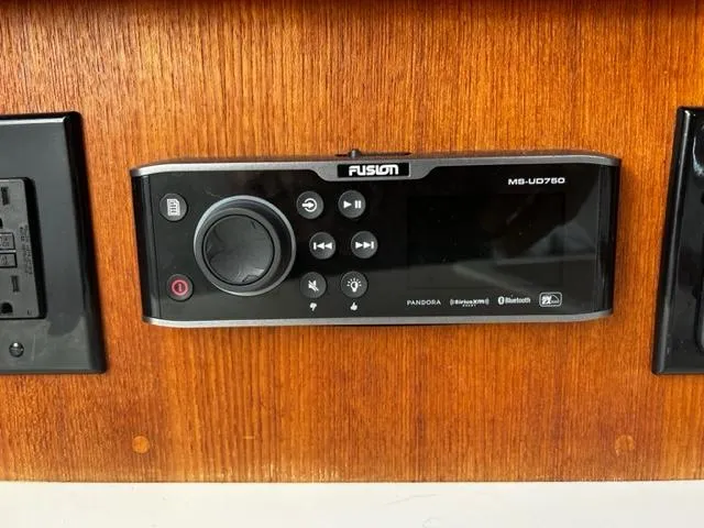 Slide: The Image of Fusion MS-UD750 marine stereo on Carolina Classic 28, 2003 model, mounted on wooden panel. - 27