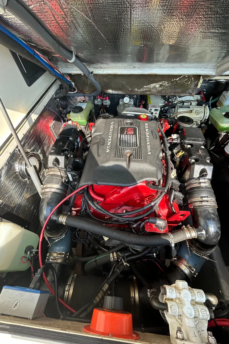 Slide: The Image of 2003 Carolina Classic 28 engine compartment with detailed view of the engine components. - 34