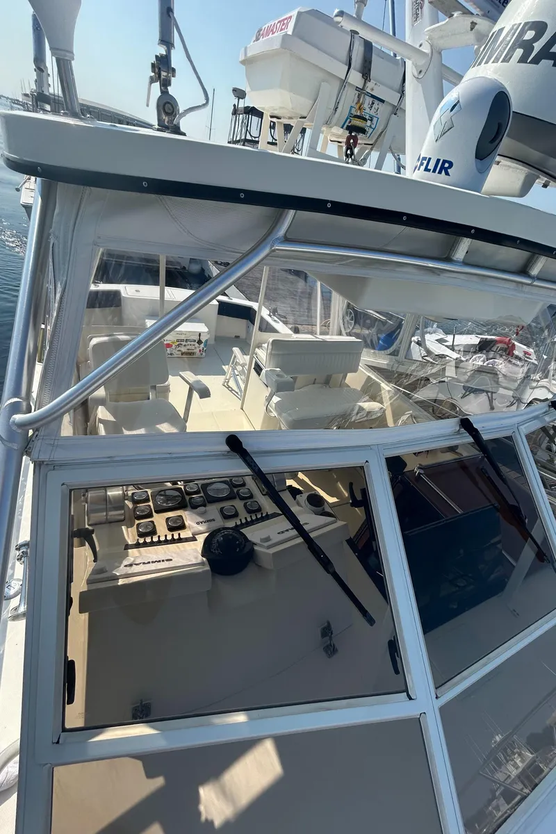 Slide: The Image of 2003 Carolina Classic 28 boat cockpit with navigation equipment and seating. - 5