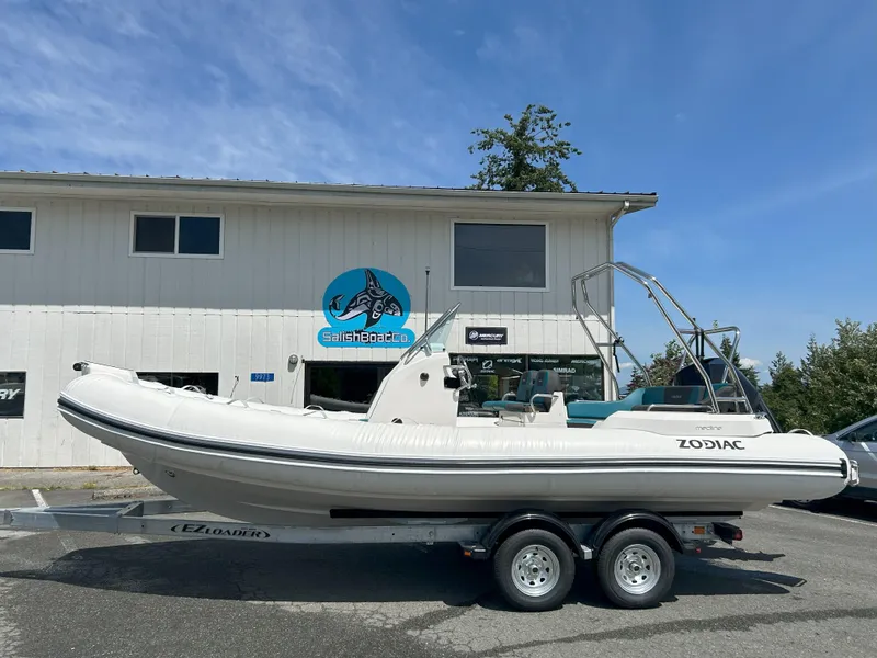 Slide: The Image of 2024 Zodiac Medline 6.8 boat on trailer outside Salish Boat Co. building. - 1