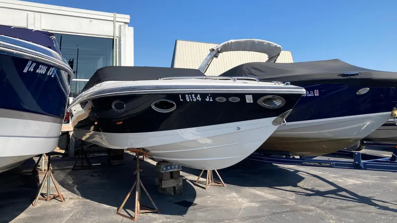 The Image of 2006 Cobalt 263 boat on stands in a marina. - 0