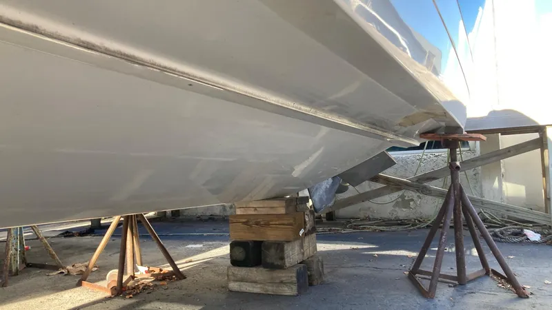 Slide: The Image of 2006 Cobalt 263 boat hull on dry dock for maintenance. - 13